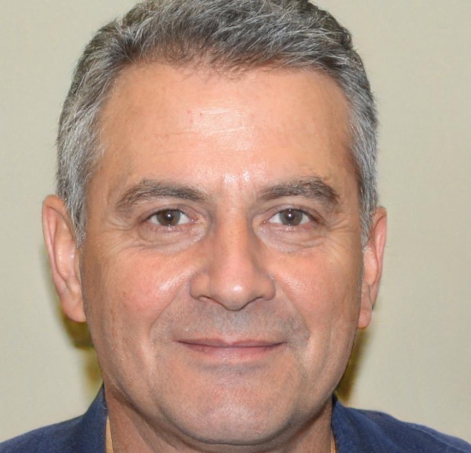 Instructor Oskar Järvinen reviewing celebration script materials